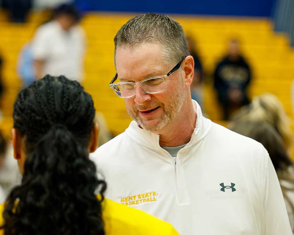 Coach talking to player